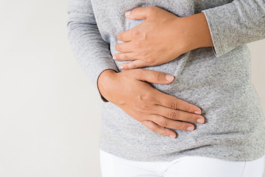 Why do I have a swollen belly during my period?